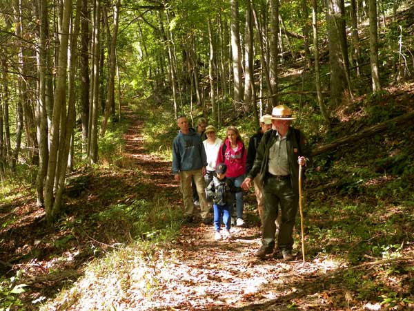 Ranger and visitors on a trail Ranger and visitors on a trail