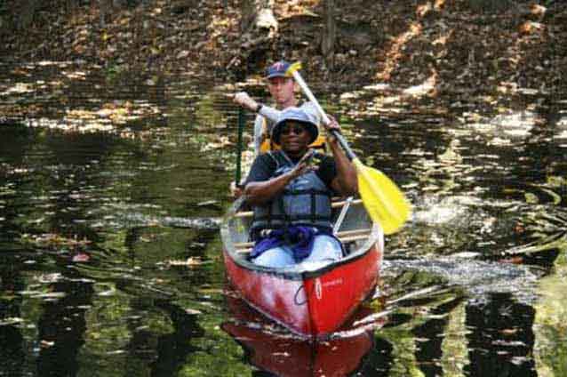 Paddlers enjoy the sites and sounds of wilderness along Cedar Creek Paddlers enjoy the sites and sounds of wilderness along Cedar Creek