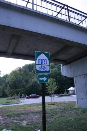 Mississippi River Trail (MRT) sign pointing the way to the trail at a trail access point Mississippi River Trail (MRT) sign pointing the way to the trail at a trail access point