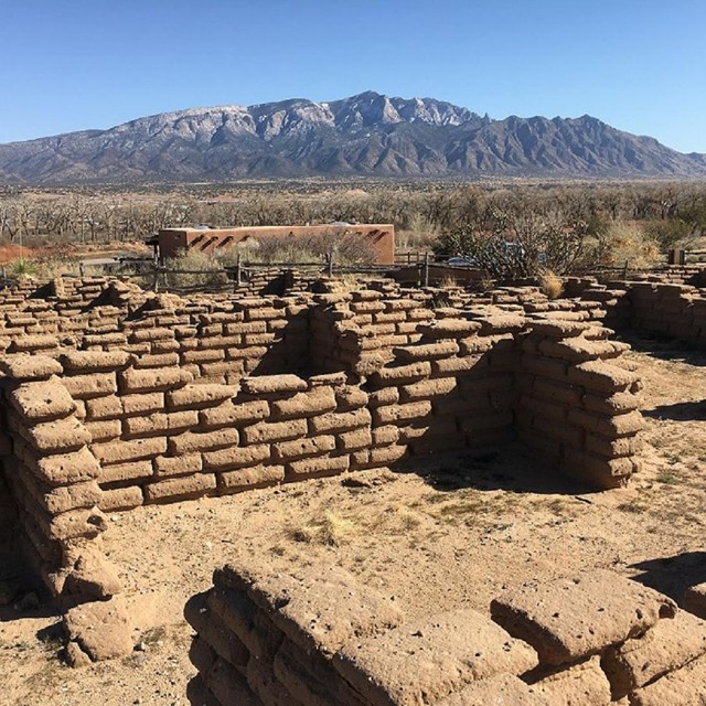 image of ruins, old brick walls, with mountain in the back