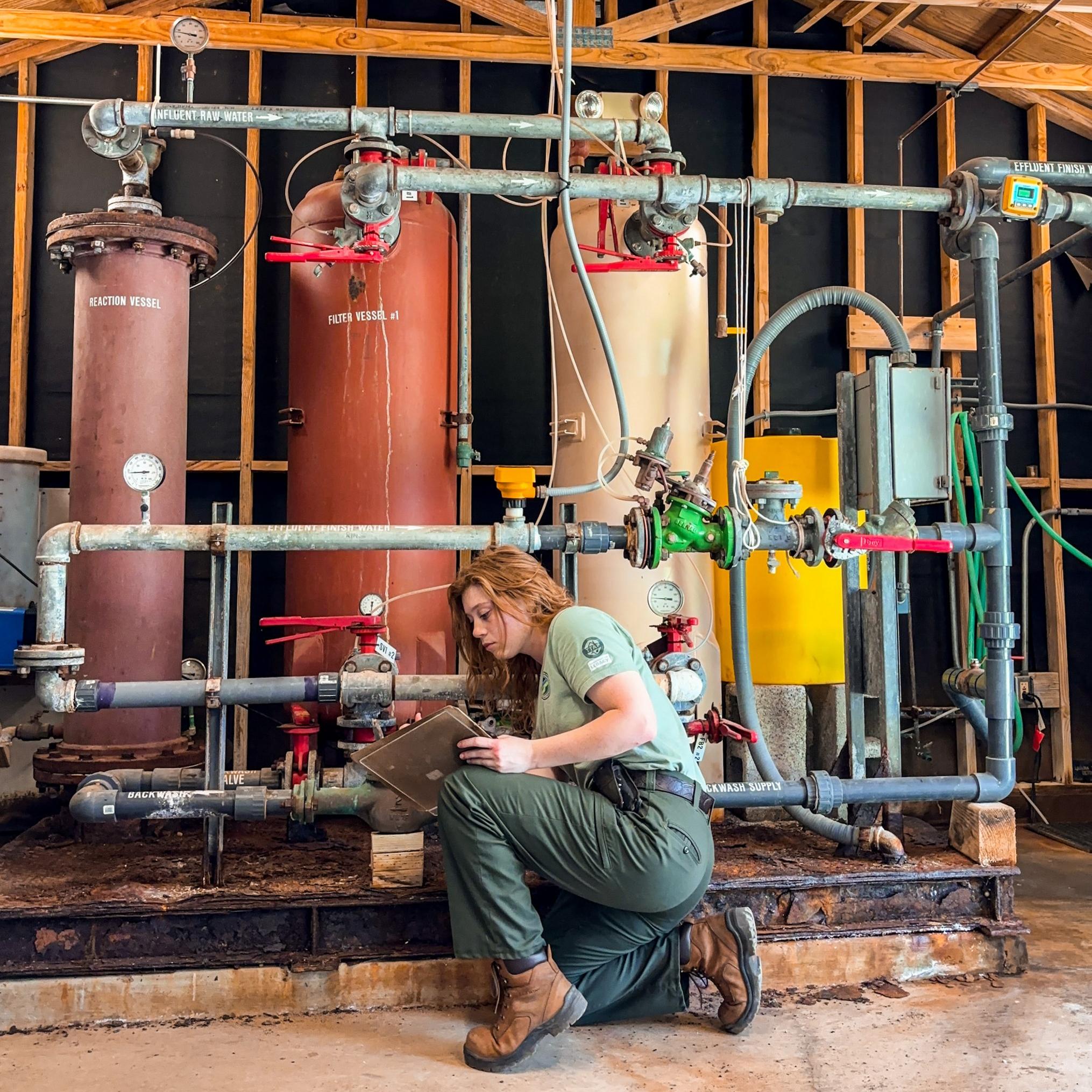 A woman working in a utility room. 