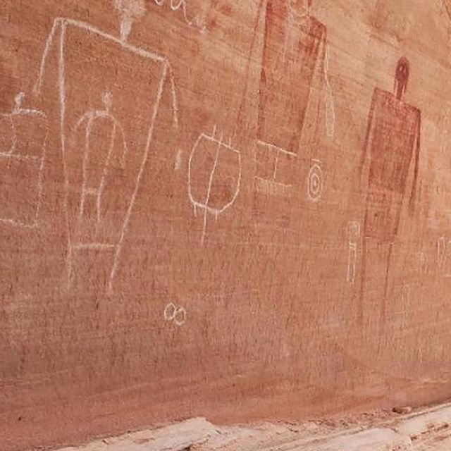 Rock panel with images of people.