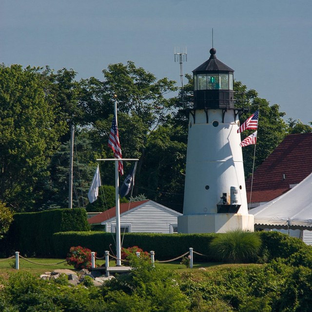 White lighthouse with flags