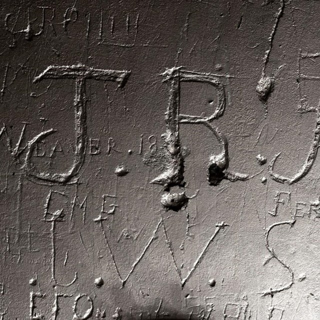 etched letters on a stone