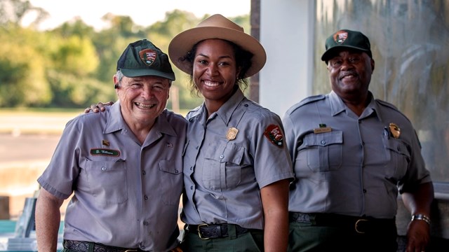 Park Ranger and park volunteer smiling