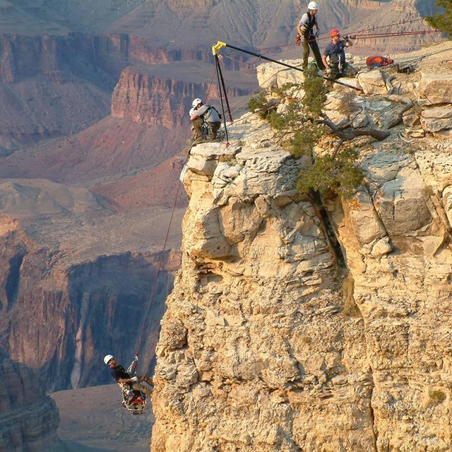 Rangers training on rope with tripod.