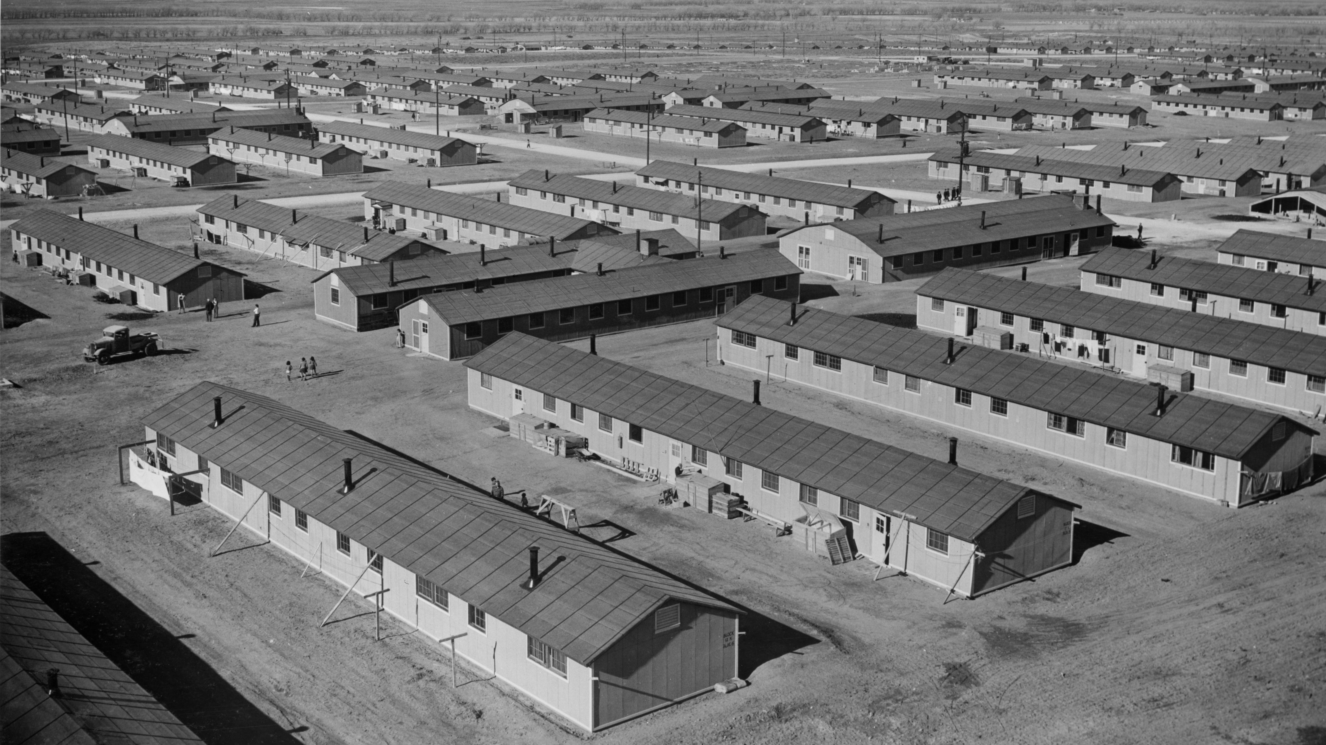 an array of barracks buildings stretching into the distance