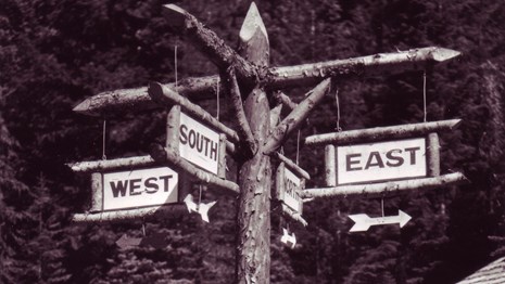 trail sign with cardinal directions, Wonderland Trail, Mount Rainier NP