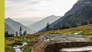 rock with mountains in the distance