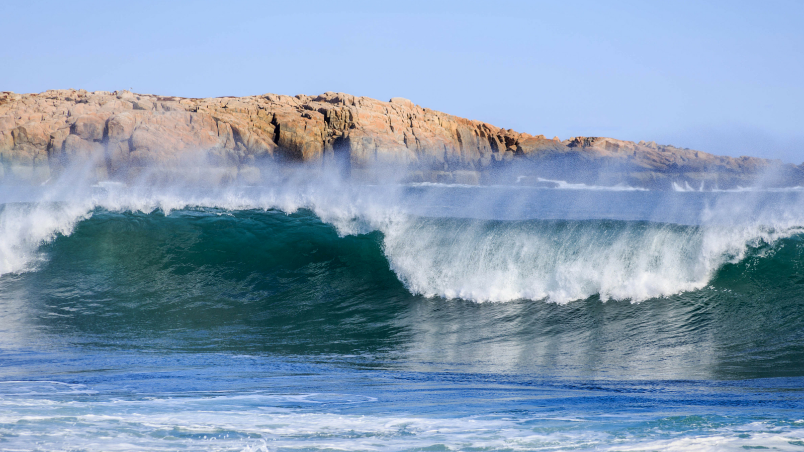 Ocean wave crashing on shore