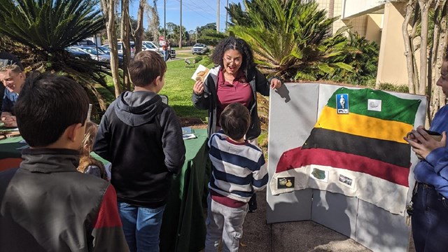 Archeologist giving presentation at public outreach event