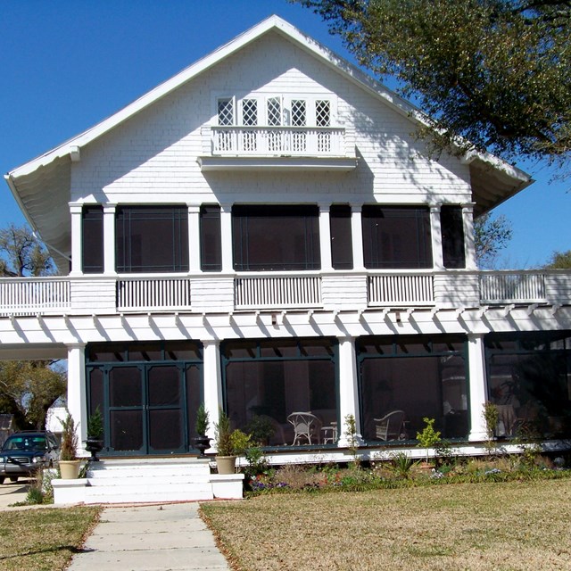 White frame house on a sunny day. (Schaffer House, MS)