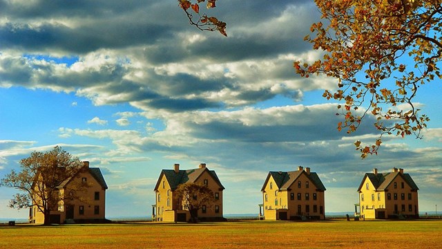 Four yellow houses in a row. 