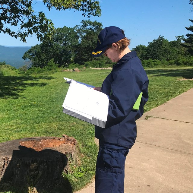 public health service officer reviews wastewater system plans