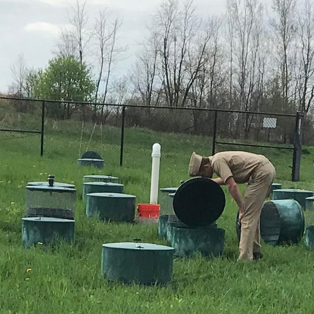 PHS Officer inspects septic system issues at a park
