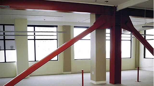 photo of a red seismic brace in a building