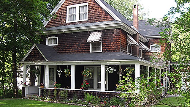 photo of a house with awnings