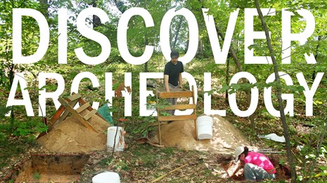 Two archeologists excavating in a wooded area with the words "DISCOVER ARCHEOLOGY" in the background
