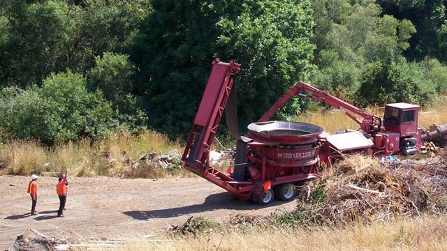 Members of the California Fire Alliance work on a hazardous fuels reduction project on a hillside.