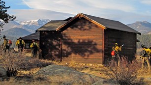 Men and women working on a fire adaptive community at Rocky Mountain National Park