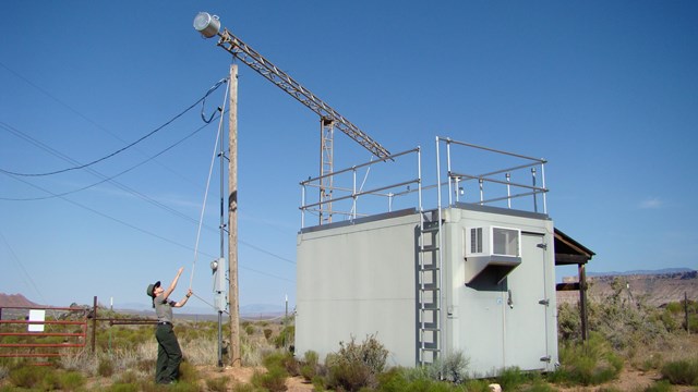 An air quality specialist at Zion NP, UT working at the air monitoring station.
