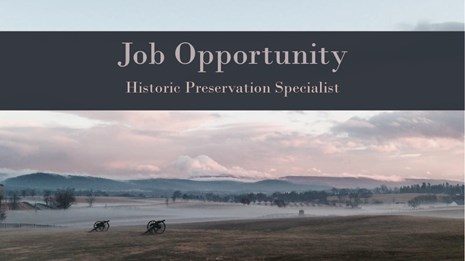 Foggy pastoral landscape at sunrise, two cannons in field in foreground. Reads “Job Opportunity"
