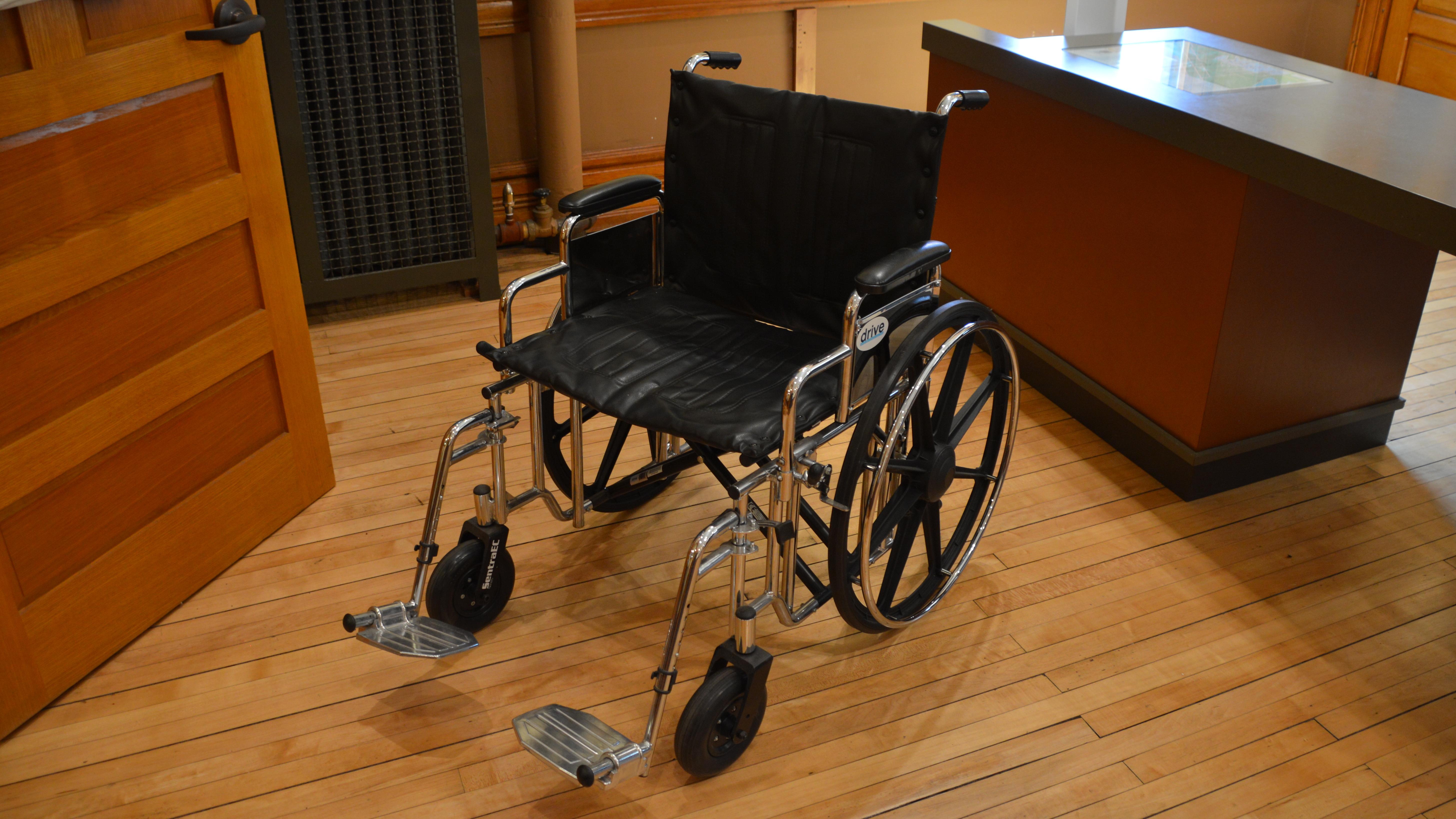An empty wheelchair in a room.