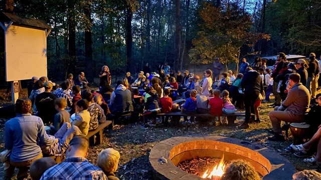 drum circle around a campfire 