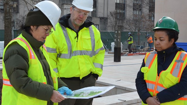 National Park Service engineer showing plans for a memorial to fellow staff