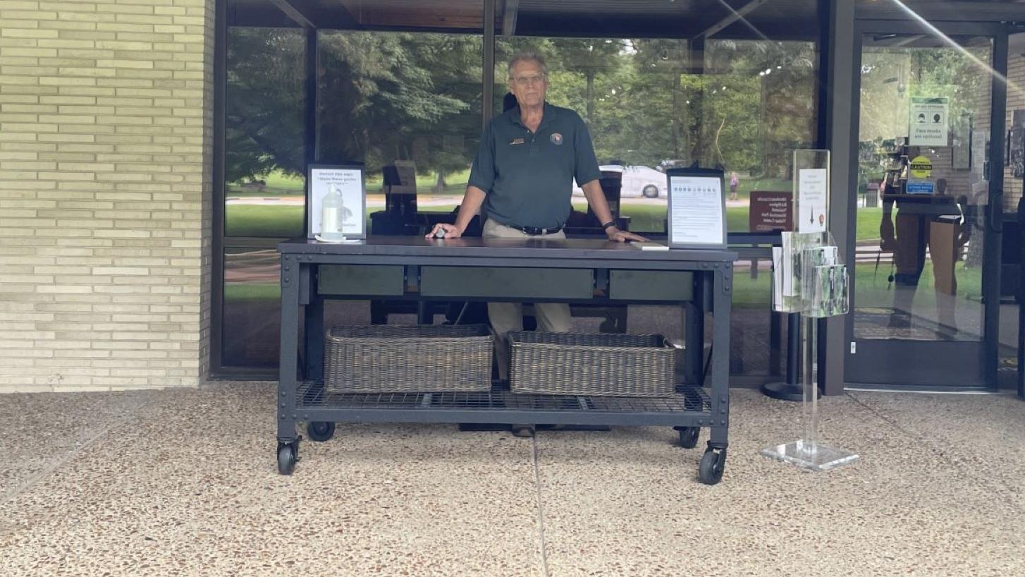volunteer standing at desk