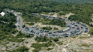Helicopter view of packed parking lot at the summit of Cadillac Mountain