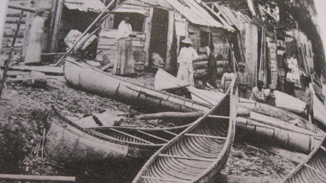 Drawing of indigenous people and a canoe