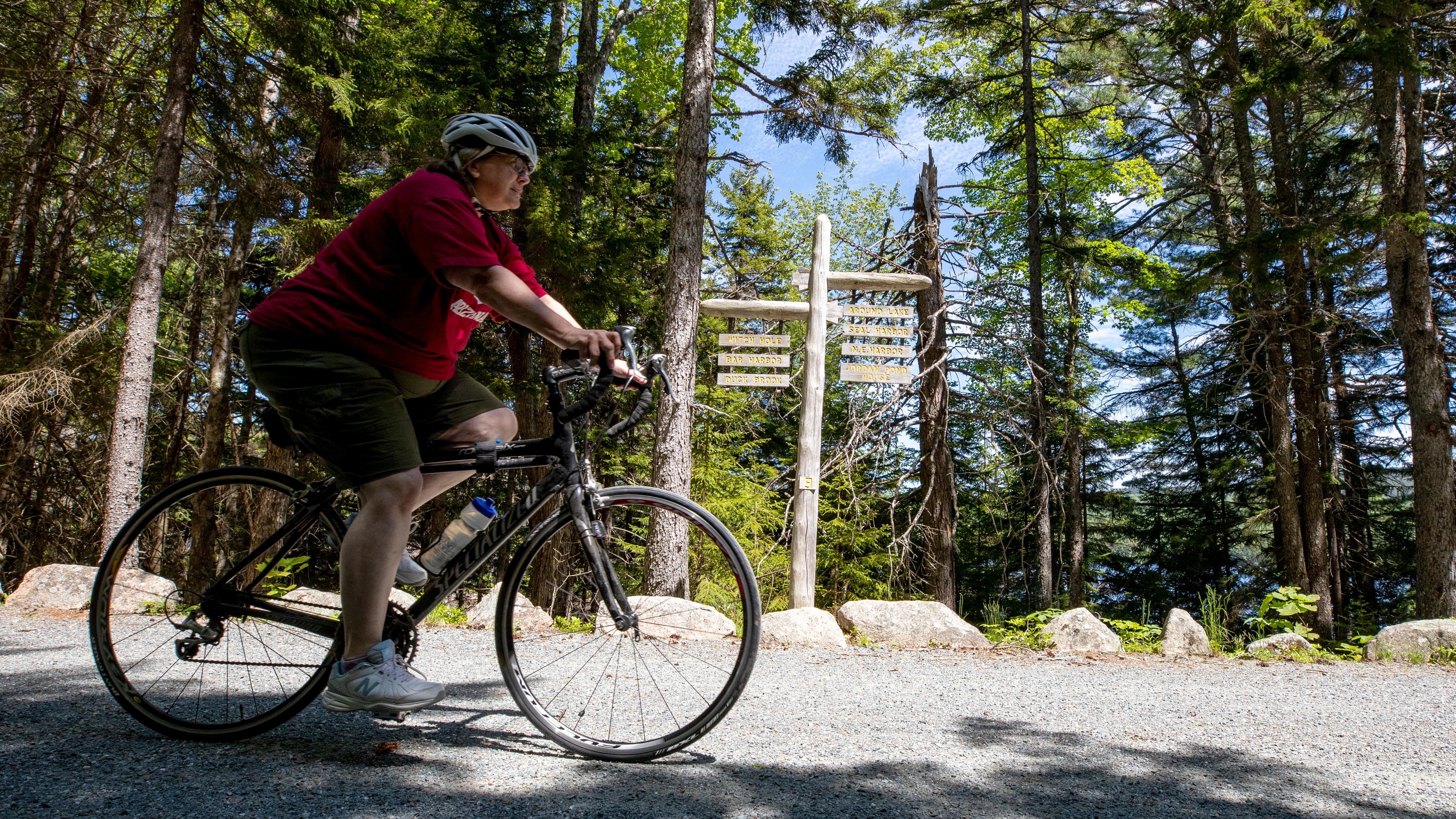 Cyclist on carriage road in Acadia National Park