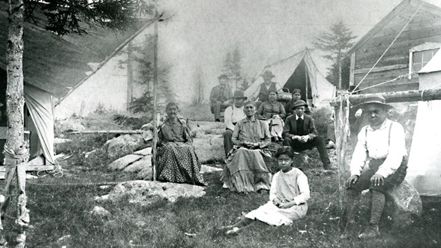 B&W photo of 19th century encampment of Native Americans