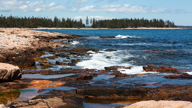 Rugged coastline with waves crashing into rocks