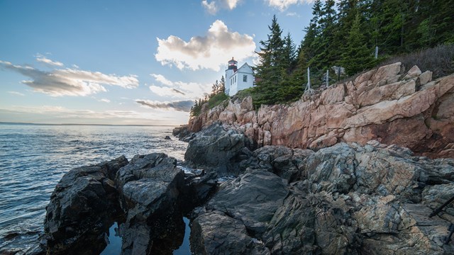 A lighthouse on a rocky coastline