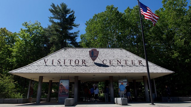 Visitor Center structure by a parking lot curb