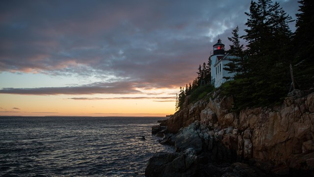 Lighthouse along rocky coastline