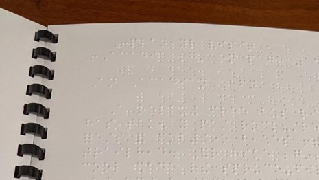 Braille text in a bound booklet