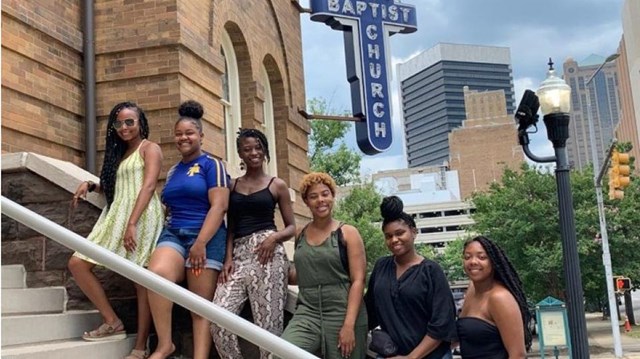 Six young African American women lining the steps of the 16th Street Baptist Church