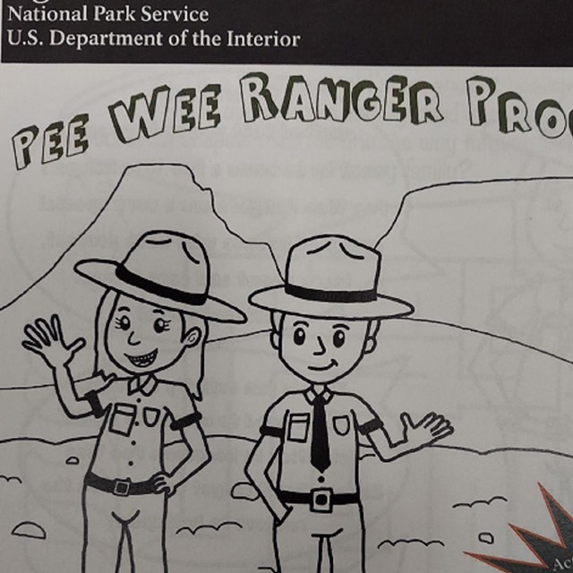2 rangers stand near the fossil hills in a black line sketch.