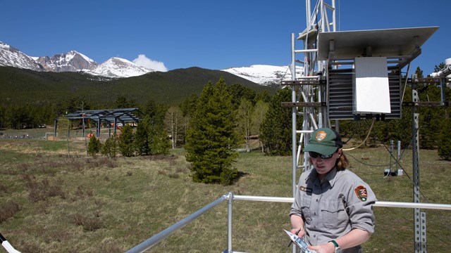 National park service monitoring technician explaining dry deposition monitoring equipment