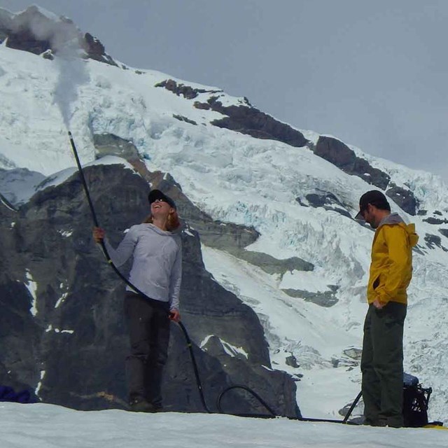 Researchers measure the mass of a glacier.