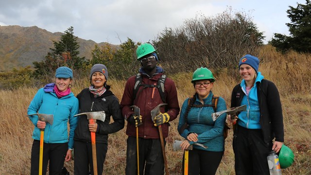 a group of trail crew volunteers pose for a photo