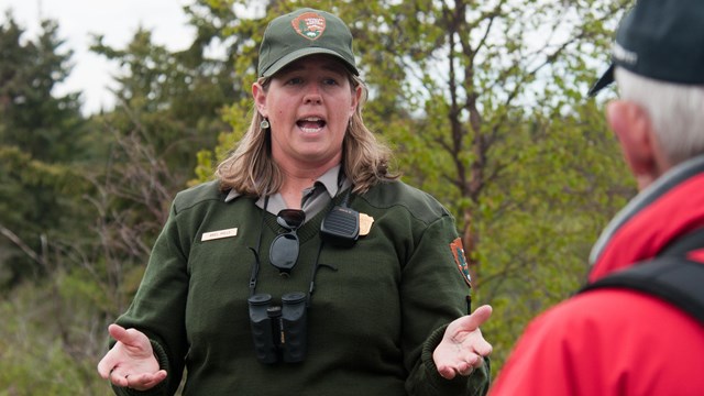 a park ranger speaks to visitors in Katmai National Park