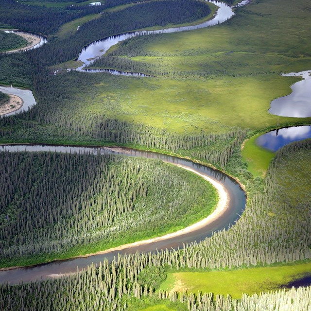 redstone river meanders through a lush green landscape