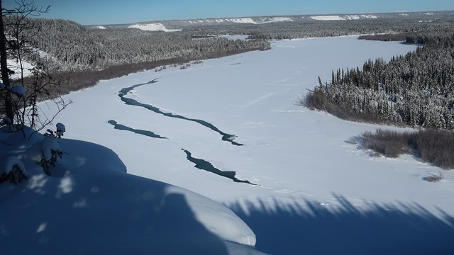 Open leads on a river in winter.