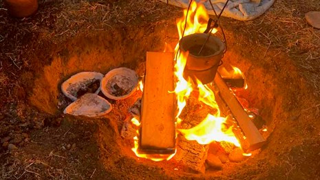 Traditional clay pots in a wood fire.