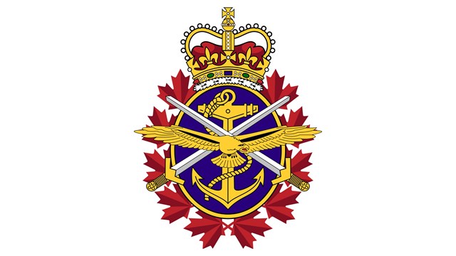 a logo of an eagle, anchor, and crossed swords surrounded by maple leaves with a crown on top
