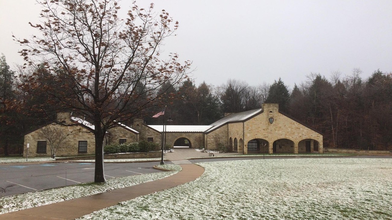 The Visitor Center stone exterior with a dusting of snow.